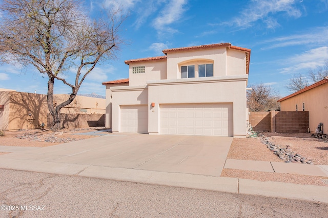 view of front of property featuring an attached garage, driveway, fence, and stucco siding