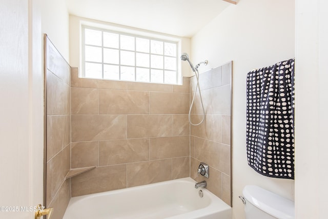 bathroom featuring toilet and shower / bathing tub combination