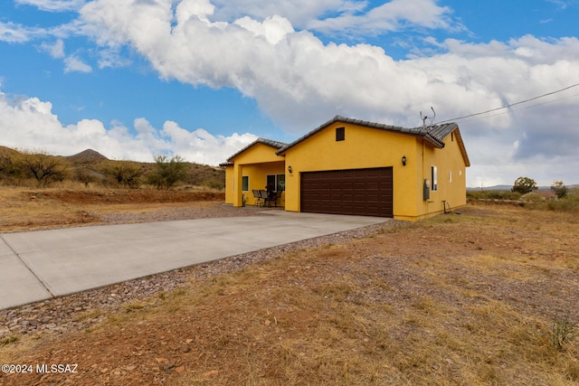 view of front of property with a garage