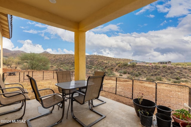 view of patio / terrace with a mountain view