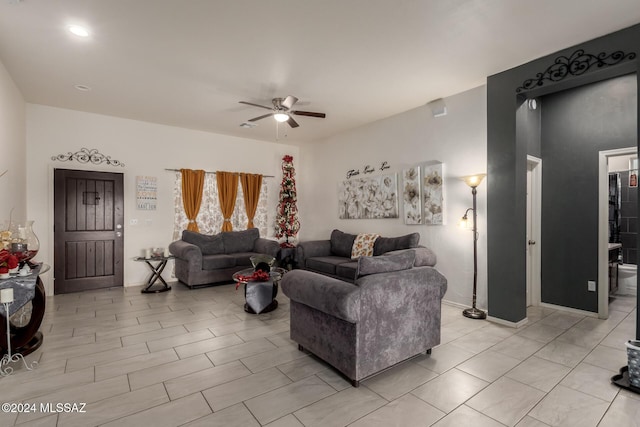 tiled living room with ceiling fan