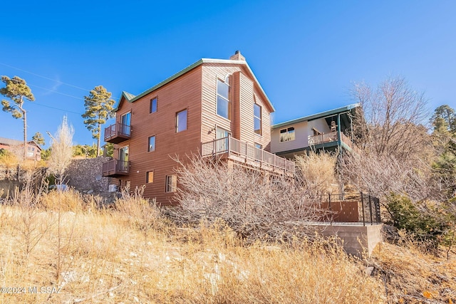 view of property exterior featuring a balcony