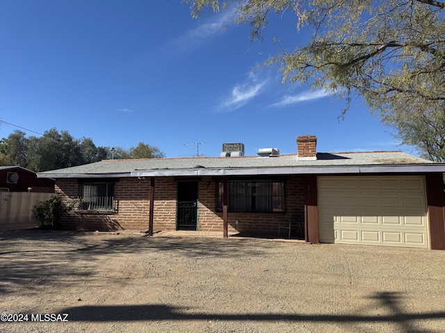 ranch-style house featuring a garage