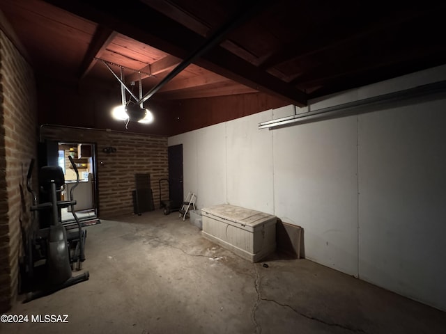 basement with brick wall