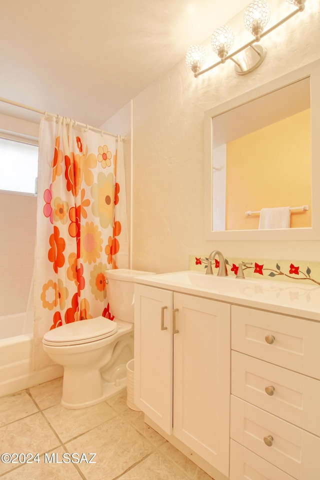 full bathroom with tile patterned flooring, vanity, toilet, and shower / bath combo with shower curtain