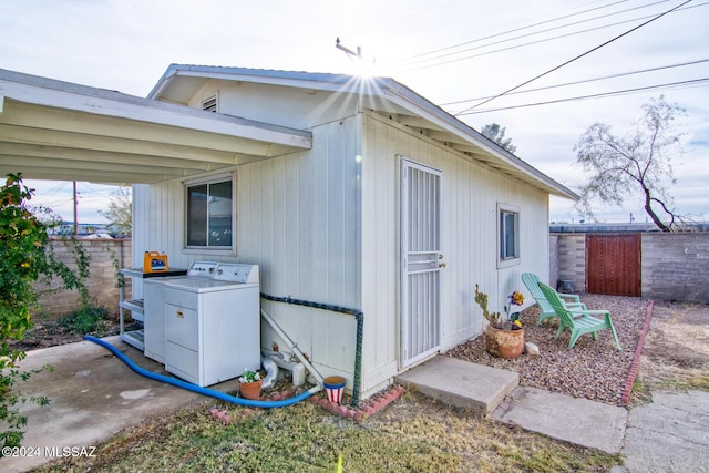 view of side of property featuring washer / clothes dryer