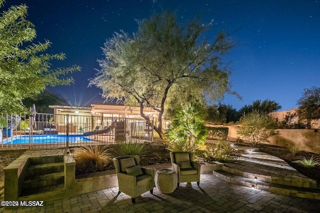 view of patio / terrace with a fenced in pool