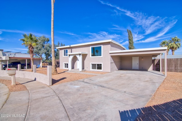 view of front of home featuring a carport