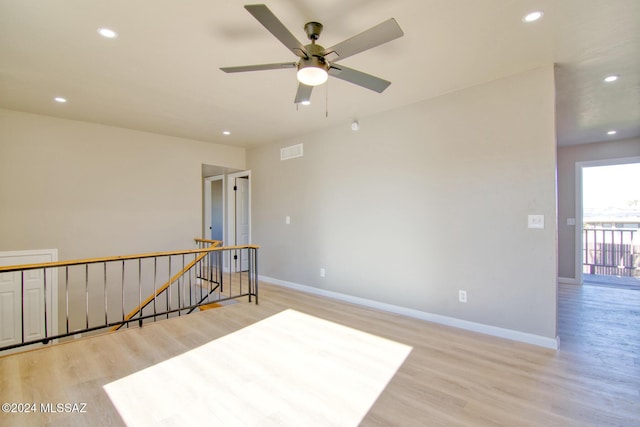 unfurnished room featuring ceiling fan and light hardwood / wood-style flooring