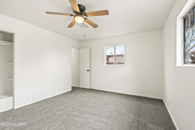 unfurnished bedroom featuring carpet flooring and ceiling fan