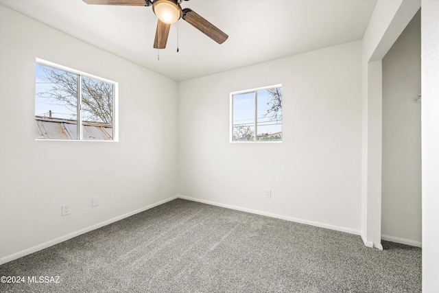 carpeted empty room with ceiling fan