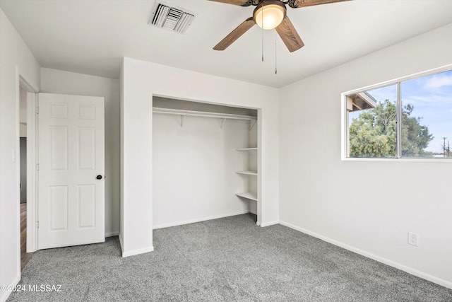 unfurnished bedroom with carpet floors, a closet, and ceiling fan