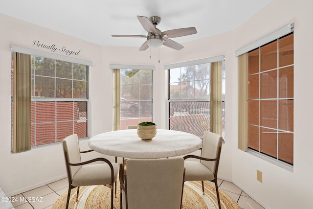 tiled dining area with ceiling fan