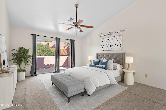 bedroom featuring access to exterior, light colored carpet, vaulted ceiling, and ceiling fan