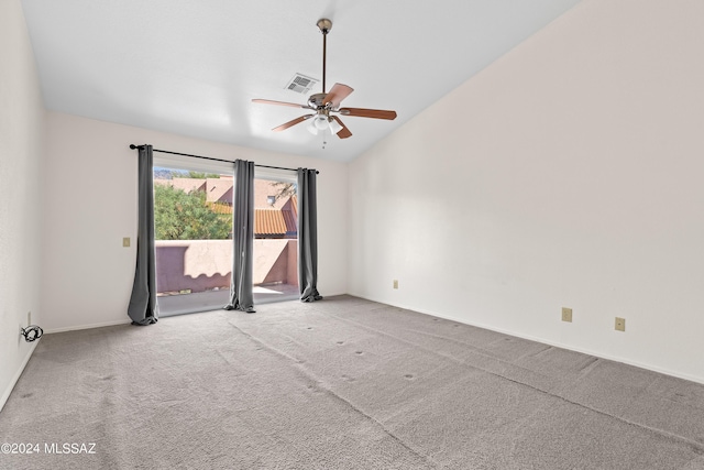 unfurnished room featuring ceiling fan, light colored carpet, and vaulted ceiling