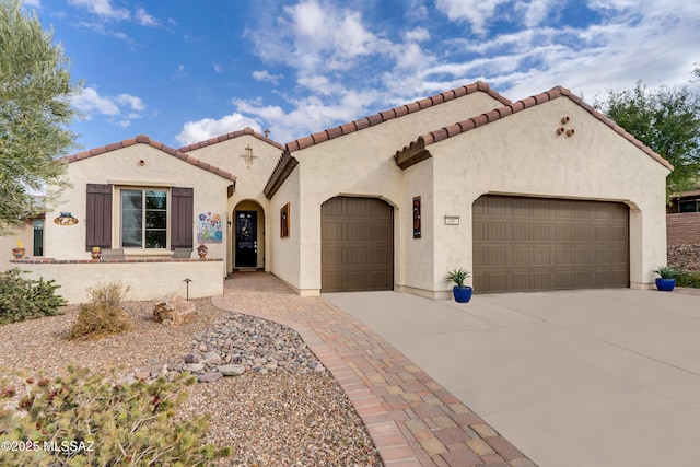 mediterranean / spanish house featuring a garage