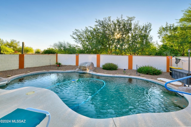 view of swimming pool featuring pool water feature