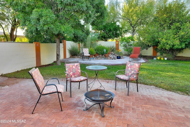 view of patio featuring an outdoor fire pit