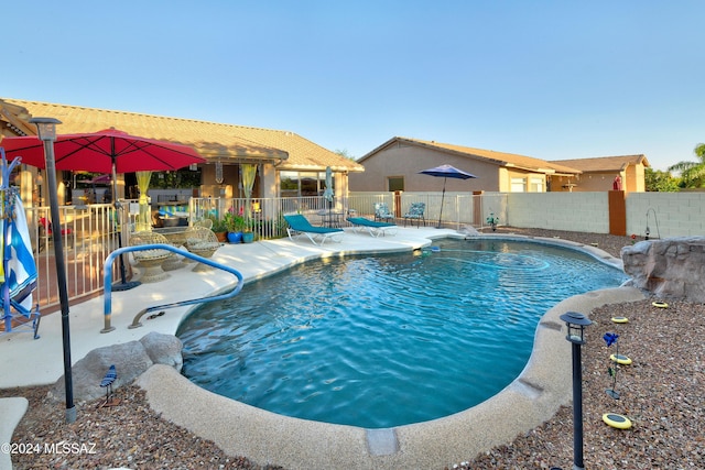 view of pool featuring a patio area and pool water feature