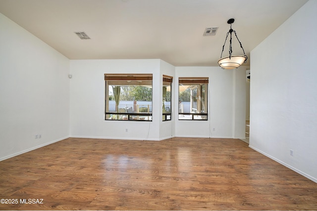 unfurnished room with dark hardwood / wood-style floors