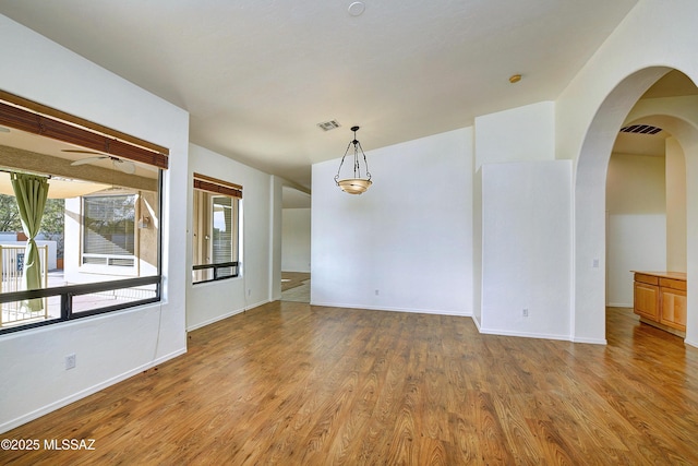 empty room featuring light hardwood / wood-style floors and ceiling fan