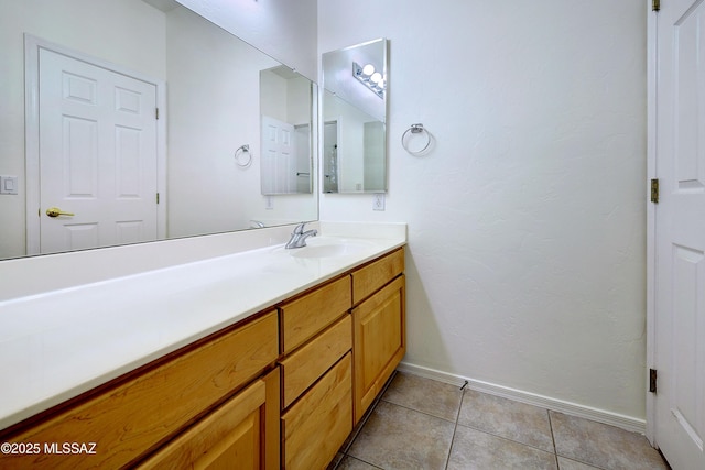 bathroom with tile patterned floors and vanity