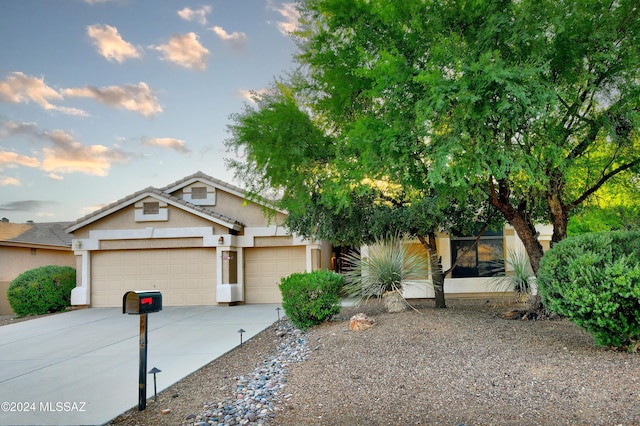 view of front of home with a garage