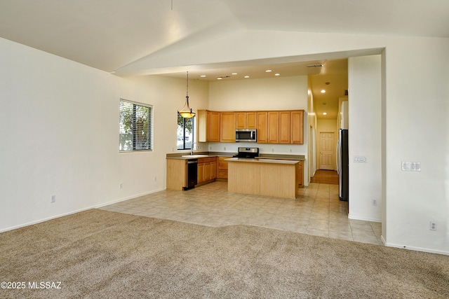 kitchen with a center island, sink, hanging light fixtures, stainless steel appliances, and light carpet