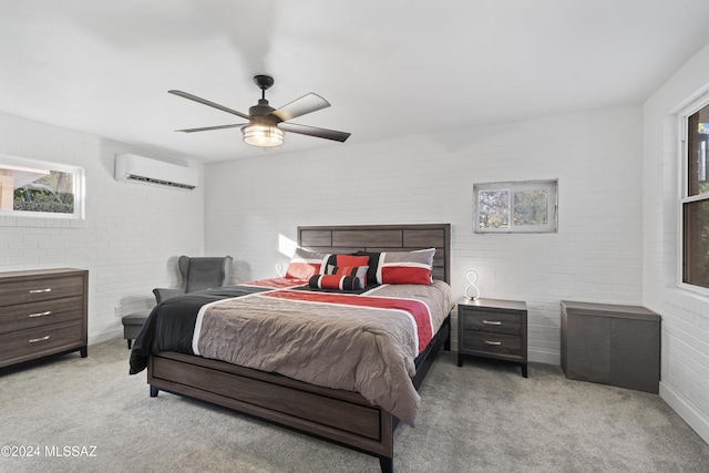 bedroom with an AC wall unit, ceiling fan, brick wall, and light carpet