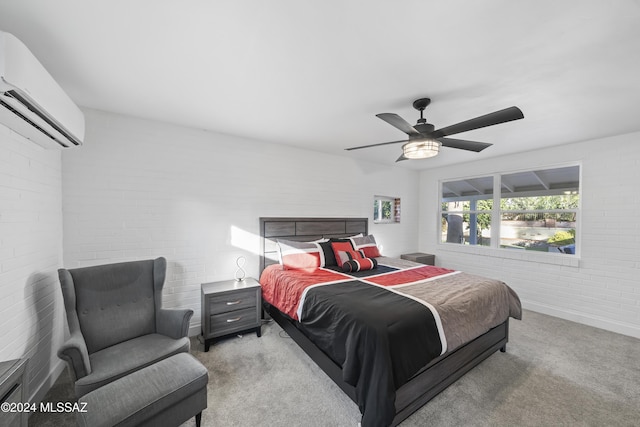 carpeted bedroom with ceiling fan, an AC wall unit, and brick wall