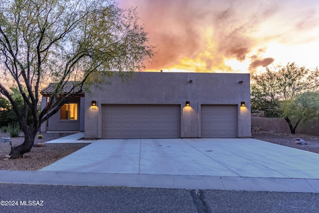 adobe home featuring a garage