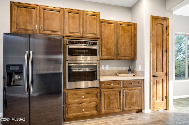 kitchen with plenty of natural light and appliances with stainless steel finishes