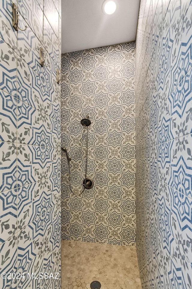 bathroom with tiled shower