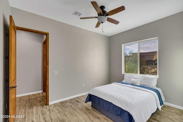 bedroom featuring ceiling fan and light wood-type flooring