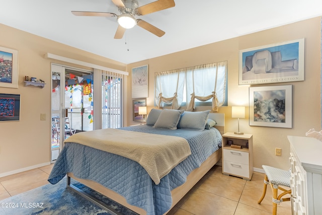 tiled bedroom with ceiling fan and access to outside