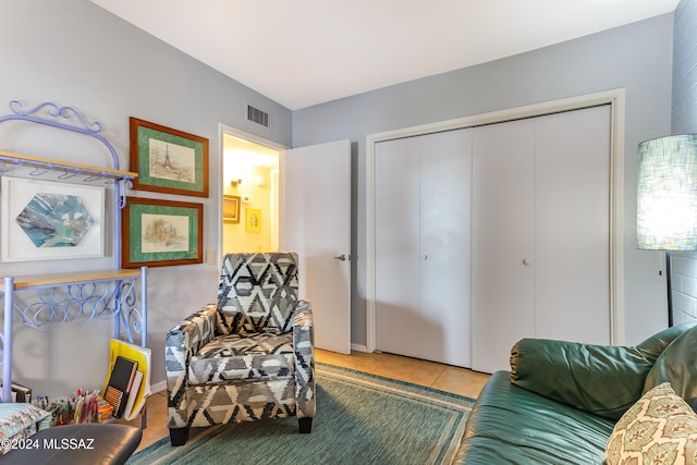 sitting room featuring tile patterned flooring