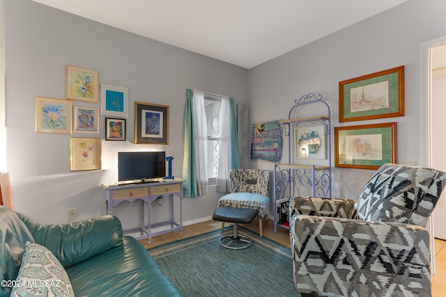 living area with tile patterned flooring