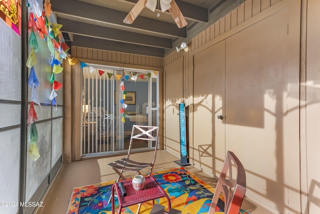 playroom with beamed ceiling and ceiling fan