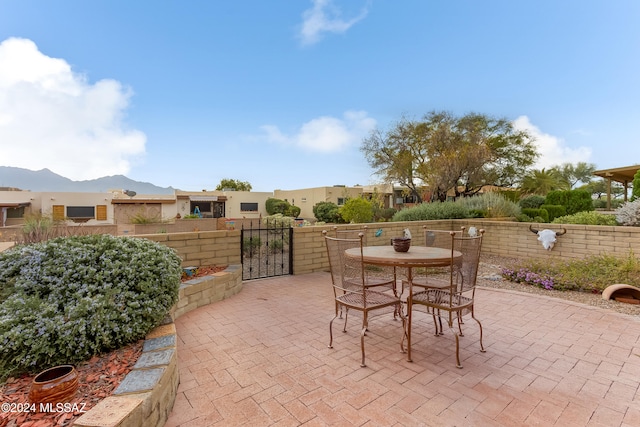 view of patio / terrace with a mountain view