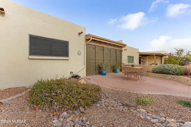 rear view of house featuring a patio