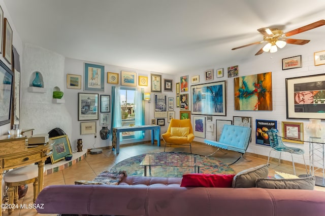 tiled living room with ceiling fan