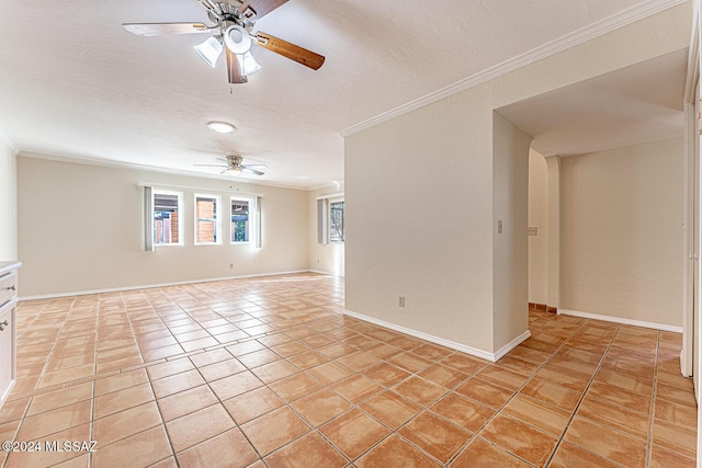 spare room featuring ceiling fan, light tile patterned floors, a textured ceiling, and ornamental molding