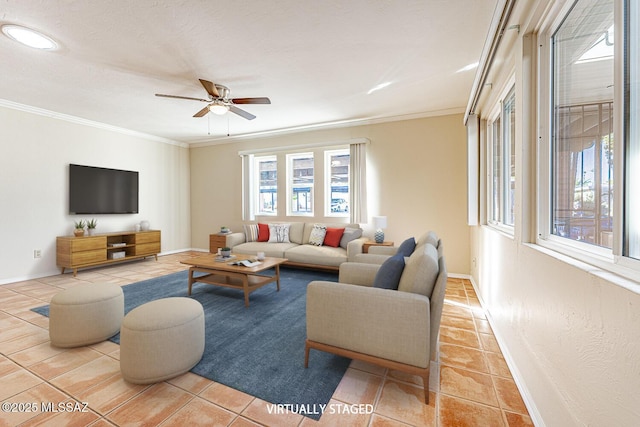 tiled living room with ceiling fan and ornamental molding