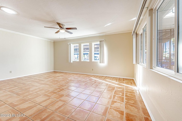 tiled empty room with ceiling fan and crown molding