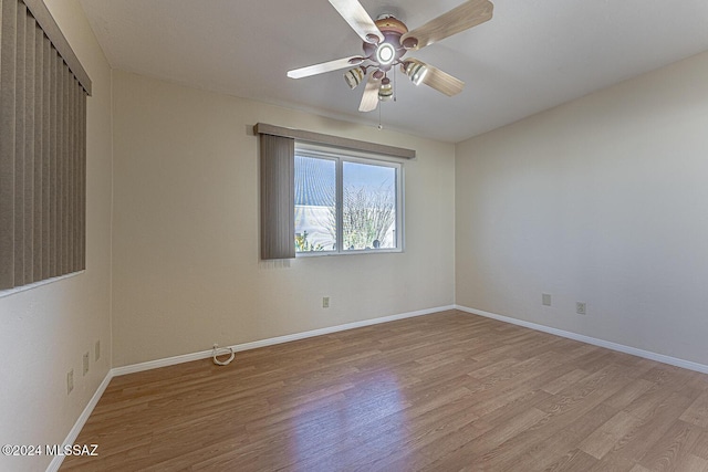 unfurnished room featuring ceiling fan and light hardwood / wood-style flooring