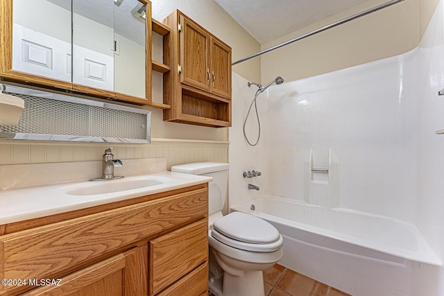 full bathroom featuring tile patterned floors, vanity, toilet, and washtub / shower combination