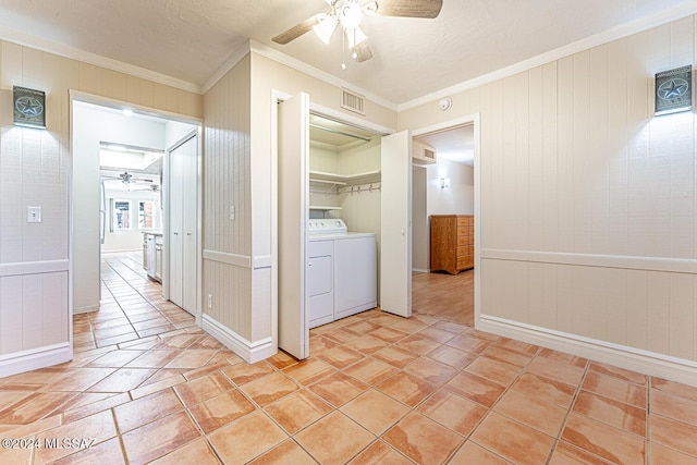 clothes washing area with a textured ceiling, ceiling fan, washing machine and dryer, and crown molding