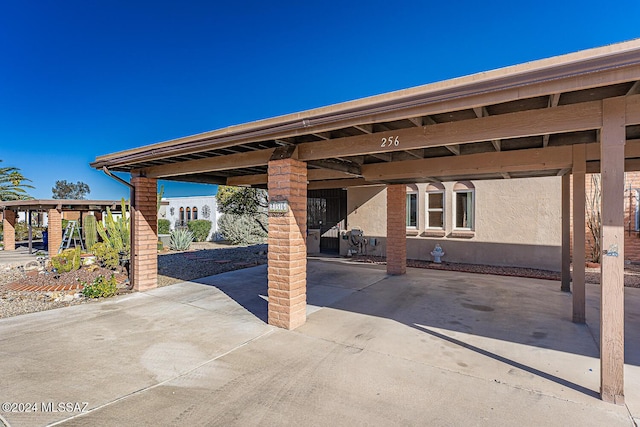 view of patio featuring a carport