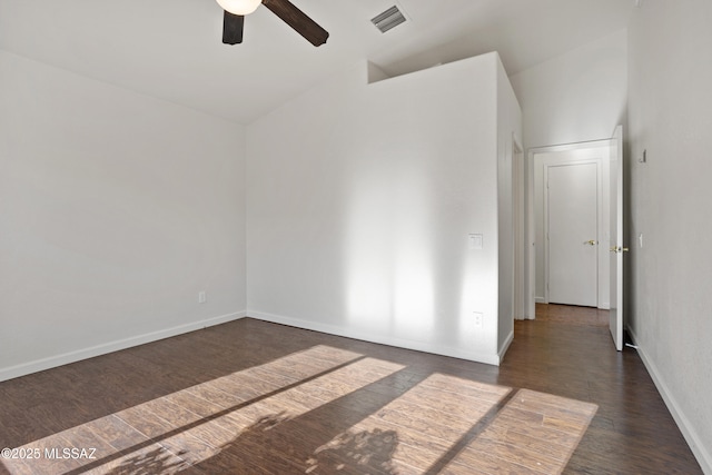 unfurnished room featuring dark wood-type flooring, ceiling fan, and vaulted ceiling