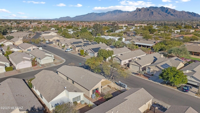 birds eye view of property with a mountain view